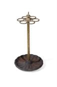 A VICTORIAN BRASS AND CAST IRON CIRCULAR STICK STAND, LATE 19TH CENTURY