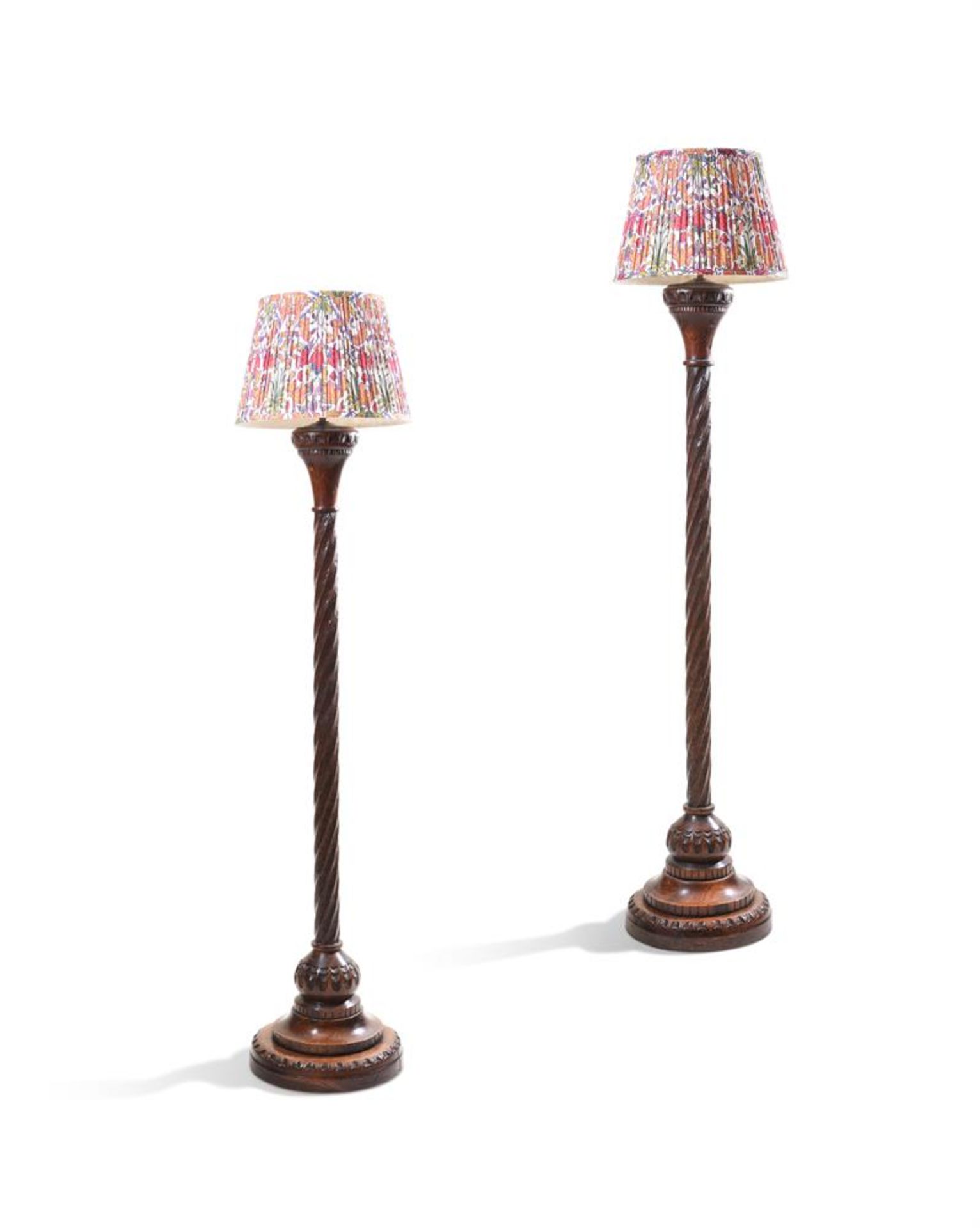 A PAIR OF CARVED OAK STANDARD LAMPS, LATE 19TH OR EARLY 20TH CENTURY