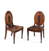 A PAIR OF GEORGE III ELM AND ASH HALL CHAIRS, IN THE MANNER OF INCE & MAYHEW, CIRCA 1770