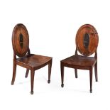A PAIR OF GEORGE III ELM AND ASH HALL CHAIRS, IN THE MANNER OF INCE & MAYHEW, CIRCA 1770