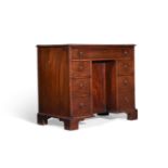 A GEORGE III MAHOGANY KNEEHOLE DESK, ATTRIBUTED TO THOMAS CHIPPENDALE, CIRCA 1775