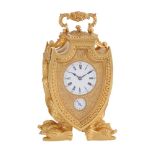 A FINE AND RARE ENGRAVED GILT BRASS SHIELD-SHAPED REPEATING ALARM CARRIAGE CLOCK