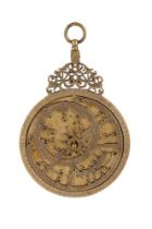 A DECORATIVE ISLAMIC BRASS ASTROLABE