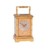 A FRENCH GILT BRASS REPEATING CARRIAGE CLOCK WITH PUSH-BUTTON REPEAT