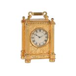A VICTORIAN ENGRAVED GILT BRASS SMALL CARRIAGE TIMEPIECE