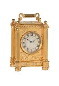 A VICTORIAN ENGRAVED GILT BRASS SMALL CARRIAGE TIMEPIECE