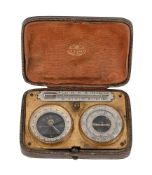 AN EDWARDIAN CASED ANEROID BAROMETER, COMPASS AND THERMOMETER COMPENDIUM
