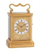 A FINE VICTORIAN GILT BRASS GIANT CARRIAGE CLOCK WITH PUSH-BUTTON REPEAT