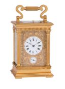 A FRENCH GILT ANGLAISE RICHE CASED GRANDE-SONNERIE ALARM CARRIAGE CLOCK WITH FINE FRETWORK PANELS