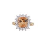 A TOPAZ AND DIAMOND CLUSTER RING, LONDON 1992