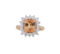 A TOPAZ AND DIAMOND CLUSTER RING, LONDON 1992