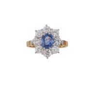 A SAPPHIRE AND DIAMOND CLUSTER RING, LONDON 1984