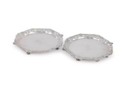 A PAIR OF GEORGE II SILVER SHAPED CIRCULAR SALVERS