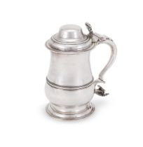 A GEORGE III SILVER BALUSTER LIDDED TANKARD