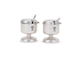 A PAIR OF SILVER MODERNIST MUSTARD POTS