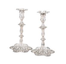 A PAIR OF GEORGE II CAST SILVER CANDLESTICKS