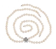 A TWO ROW CULTURED PEARL NECKLACE TO A DIAMOND BOW PANEL