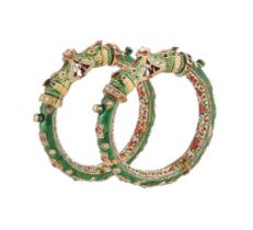 A PAIR OF 19TH CENTURY INDIAN GOLD, GEM AND JAIPUR ENAMELLED MAKARA HEAD KADA BANGLES