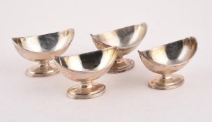 A MATCHED SET OF FOUR GEORGE III SILVER NAVETTE SALTS