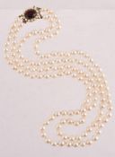A TWO ROW CULTURED PEARL NECKLACE WITH GARNET AND CULTURED PEARL CLASP, BIRMINGHAM 1989