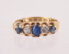 A LATE VICTORIAN SAPPHIRE, DIAMOND AND BLUE DOUBLET FIVE STONE RING, LONDON 1886