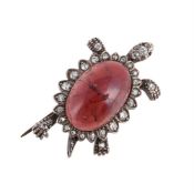 A DIAMOND AND GARNET TORTOISE BROOCH
