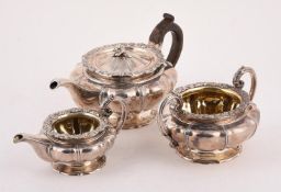 A GEORGE IV SILVER LOBED CIRCULAR THREE PIECE TEA SET