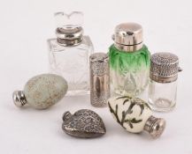 A COLLECTION OF SILVER MOUNTED SCENT BOTTLES