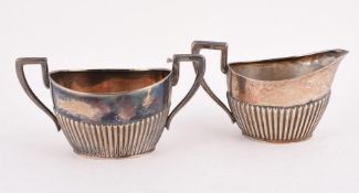 A DUTCH SILVER OVAL HALF LOBED CREAM JUG AND SUGAR BOWL