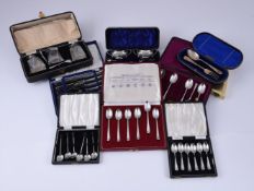 A COLLECTION OF CASED SILVER SETS