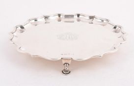 A SILVER SHAPED CIRCULAR SALVER