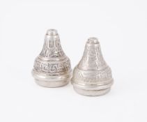 A PAIR OF EGYPTIAN SILVER COLOURED TABLE ORNAMENTS