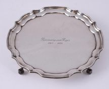 A SILVER SHAPED CIRCULAR SALVER
