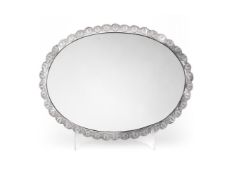 AN IRANIAN SILVER COLOURED SHAPED OVAL MIRROR