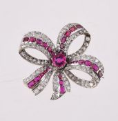 A RUBY AND DIAMOND BOW BROOCH, CIRCA 1900