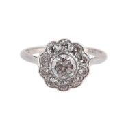 A MID 20TH CENTURY DIAMOND FLOWER HEAD CLUSTER RING