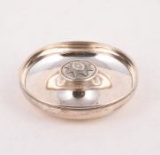 A SILVER CIRCULAR ASHTRAY