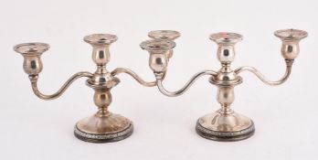 A PAIR OF AMERICAN SILVER COLOURED PRELUDE PATTERN THREE LIGHT CANDELABRA
