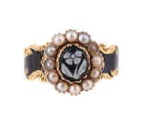 A VICTORIAN 18 CARAT GOLD, ONYX, HALF PEARL AND ENAMEL MOURNING RING, LONDON 1874