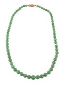 A GRADUATED JADEITE JADE BEAD NECKLACE