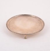 A GEORGE III SILVER CIRCULAR SALVER