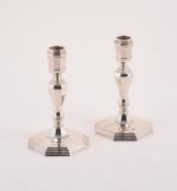 A PAIR OF SILVER CANDLESTICKS