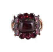 A GEORGIAN AND LATER GARNET CLUSTER RING