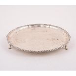 A SILVER SHAPED CIRCULAR SALVER