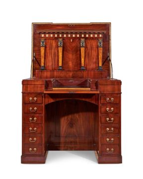 AN EMPIRE BRONZE MOUNTED, PARCEL GILT, AMBOYNA AND INLAID MAHOGANY DESK, CIRCA 1810