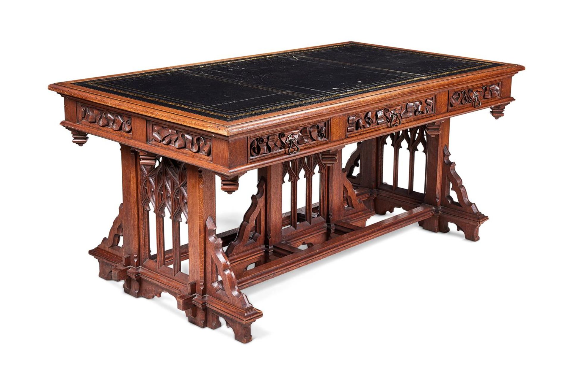 A MID VICTORIAN OAK LIBRARY TABLE IN THE GOTHIC TASTE, CIRCA 1860