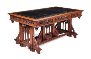 A MID VICTORIAN OAK LIBRARY TABLE IN THE GOTHIC TASTE, CIRCA 1860