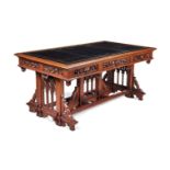 A MID VICTORIAN OAK LIBRARY TABLE IN THE GOTHIC TASTE, CIRCA 1860