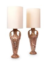 A PAIR OF POTTERY TERRE MÊLÉE VASES AFTER THE ANTIQUE, ADAPTED FOR ELECRICITY AS LAMPS