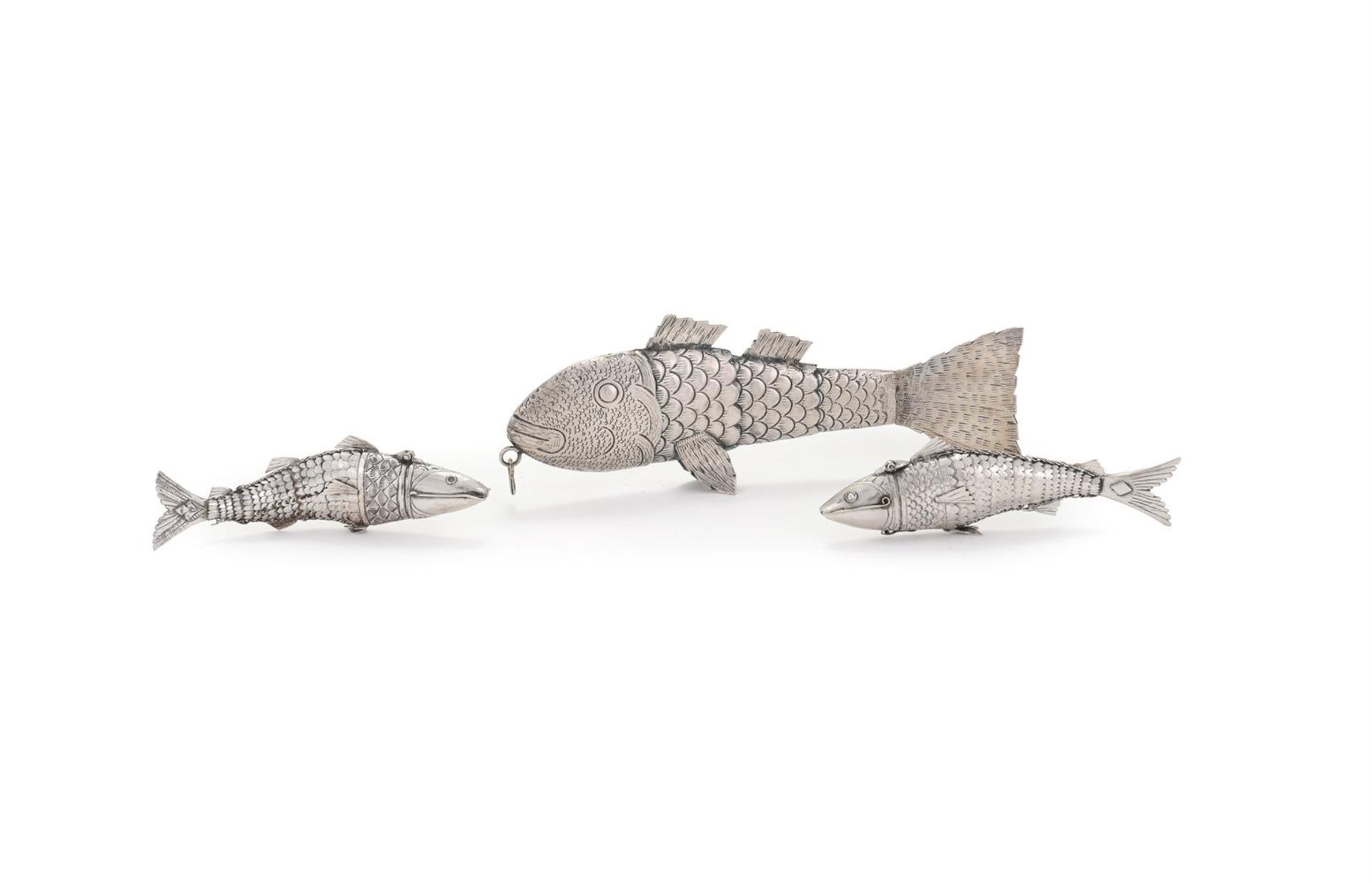 THREE WHITE METAL ARTICULATED FISH